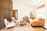 Upstairs open concept living room with natural lighting.