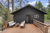 Outdoor living space and view of second floor of home from the outside.