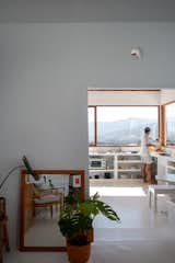 The open doorway that separates the main living area from the kitchen used to be the entrance to the house. Back then, you had to go outdoors to access the open-air kitchen and bathroom.