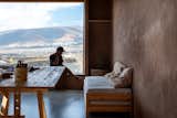 Light streams into the the second house, which is mostly used as a creative space, studio and as the home of the couple's design brand, Latitud Fuego, through a giant south-facing window at one end of the rectangular building.