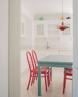 Chairs custom made by Local Local, combined with a vintage Louis Poulsen lamp.