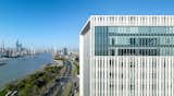 Façade design of the top floors   Photo 14 of 16 in Shanghai Pudong Development Bank New Office stands aside Huangpu River by Aedas