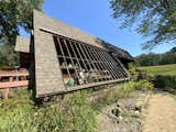 The existing greenhouse, constructed from reclaimed materials