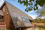 Exterior, Shingles Roof Material, Saltbox RoofLine, Wood Siding Material, House Building Type, and Mid-Century Building Type The renovation didn’t majorly change the structure of the home  Photo 13 of 13 in Before & After: From Greenhouse to Sunlit Sanctuary by Loren Wood Builders