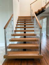 Staircase, Glass Railing, Wood Tread, and Wood Railing  Photo 2 of 11 in Before & After: This Staircase Gets a Contemporary Revamp by Loren Wood Builders