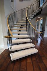 Staircase, Metal Railing, and Wood Tread  Photo 3 of 11 in Before & After: This Staircase Gets a Contemporary Revamp by Loren Wood Builders