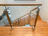 Staircase, Glass Railing, Wood Tread, and Wood Railing  Photo 6 of 11 in Before & After: This Staircase Gets a Contemporary Revamp by Loren Wood Builders