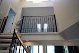 Staircase, Wood Tread, and Metal Railing  Photo 7 of 11 in Before & After: This Staircase Gets a Contemporary Revamp by Loren Wood Builders