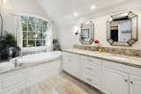 oversize soaking tub with an excellent view of the creek and golf course