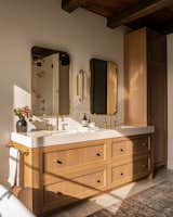 Custom oak vanity in warm natural stain gives warmth to the space. 4" countertops create a more luxe feel and unlacquered brass plumbing with patina and provide character over time. 