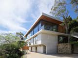 The home's design evolves from a solid concrete base to lighter, more ethereal upper levels, mirroring the ascent from earth to sky. This progression is not merely aesthetic; it's an integral part of the home's character, emphasising the transition between spaces. Using a mix of materials from concrete, timber and steel, the construction and materials embody a commitment to lasting quality - ensuring structural integrity for generations to come.
