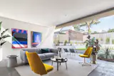 Living room - doors slide wide, Italian limestone flooring extends from inside to out.