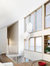 Italian pendants take center stage over the stair.