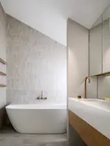 Bath and stone tile wall.