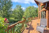 Outdoor, Large Patio, Porch, Deck, Trees, Shrubs, Back Yard, Flowers, Wood Patio, Porch, Deck, Gardens, and Grass Terrace 2  Photo 5 of 32 in Pure Michigan Chalet by Luxury Living International