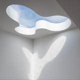 The natural light diffuses through its skylight in various angles making space really fun and intriguing