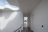 The second-floor corridor leads to a terrace