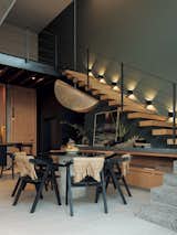 Double-height spaces and floating staircases in the duplex.

