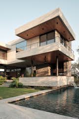 Rear façade, where the play of balconies with the concrete beams can be appreciated.