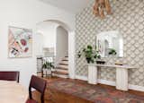 Entry art by Whitney Spicer. Vintage rug and Serena & Lily pendant
