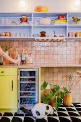 Kitchen, Wood Cabinet, Wine Cooler, Marble Counter, Beverage Center, Cement Tile Floor, Colorful Cabinet, and Ceramic Tile Backsplashe A narrow bar counter was added. Pink zellige tiles coordinate with the Tennessee marble top.  Photo 7 of 21 in La Croix House by Jennifer Martin