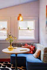 Kitchen, Cement Tile Floor, Marble Counter, and Pendant Lighting Cozy upholstered banquette nook  Photo 2 of 21 in La Croix House by Jennifer Martin