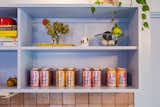 Kitchen, Marble Counter, Open Cabinet, Wood Cabinet, Colorful Cabinet, and Ceramic Tile Backsplashe The color palette from the project was derived from La Croix sparkling water... our client's favorite fizzy water.  Photo 5 of 21 in La Croix House by Jennifer Martin