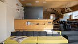 Cooking sometimes resembles the feeling of the captain's bridge. The space in the living room is opened up to the roof, which adds brightness and spaciousness.  Photo 6 of 15 in Family House Kittsee by Beionde.