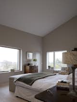 Bedroom, Table Lighting, Lamps, Dresser, Bed, and Light Hardwood Floor  Photo 5 of 7 in Bavent House by Hudson Architects