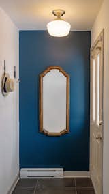 The new entryway, adorned with a vintage mirror. 