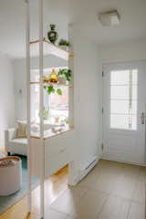 In the entryway, the custom storage unit acts as a catch-all for keys and mail. 