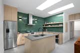 A pop of colour from the vintage looking tile selection and lots of natural light makes the kitchen stand out.