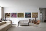 living room with Madalena Dos Santos Reinbolt's tapestries, Sergio Rodrigues' Millor sofa and Paulo Mendes da Rocha's paulistano chair