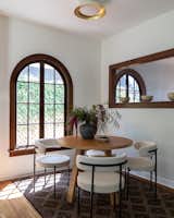 Dining Room, Table, Chair, Ceiling Lighting, and Medium Hardwood Floor Breakfast nook  Photo 6 of 23 in Spanish Kensington by Vivo Design Studios