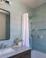 Bath Room, Marble Counter, Undermount Sink, Alcove Tub, Concrete Wall, Marble Floor, and Wall Lighting Kids bath shower  Photo 20 of 23 in Spanish Kensington by Vivo Design Studios