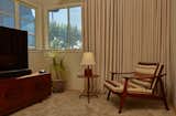 The game room already featured this distinctively retro dad-den wall panelling and carpeting.  So Jared Frank studio leaned into it with matching velvet blackout drapery.  
