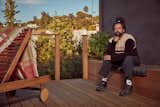 Reggie Watts enjoying the custom deck with built-in seating and planters designed and built for him by Jared Frank Studio.