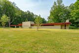 Concrete Siding Material, Exterior, House Building Type, and Flat RoofLine Pratt Home Front View  Photo 2 of 7 in Two Frank Lloyd Wright houses for sale together in Michigan by Victoria Krause Schutte