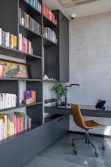Office The study table and the vertical storage provide ample space for the display of knick knacks  Photo 8 of 12 in The Grey House by GA Design