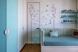 In the daughter’s bedroom, the wall behind the bed has custom-designed and printed wallpaper, giving the room a gentle and soft look