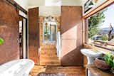 Bathroom with weathering steel highlights and clawfoot tub