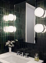 Main Bathroom Zellige tiles and custom mirror storage. RBW vanity lighting.