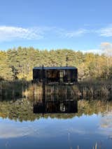 Country REDUKT Tiny House as a hotel cabin by the water.