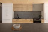 Kitchen, Dishwasher, White Cabinet, Cooktops, Refrigerator, and Wood Cabinet  Photo 11 of 16 in Le refuge de la plage by SGD A