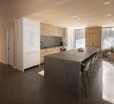 Kitchen, Cooktops, Wood Cabinet, Refrigerator, Drop In Sink, Recessed Lighting, Concrete Floor, and White Cabinet  Photo 9 of 16 in Le refuge de la plage by SGD A
