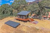 Tiny home / ADU. Exterior finishes are Nichiha cement siding, Casement windows, 10 foot wide glass wall, Ipe hardwood deck boards, Metal post and stainless steel cable handrail