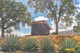 Tiny home / ADU. Exterior finishes are Nichiha cement siding, Casement windows, 10 foot wide glass wall, Ipe hardwood deck boards, Metal post and stainless steel cable handrail