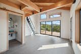 Open Beam Construction. The entry door is a 10 foot glass wall 3 panel slider
