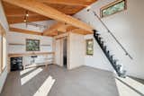 Metal stairs leading to the bedroom loft area