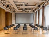 Office, Chair, and Medium Hardwood Floor Second floor event hall: guests and friends of the company are invited to public lectures and meetings, which Kovalska often initiates.     Photo 7 of 15 in Kovalska Group head office in Kyiv, Ukraine by Matviy Mustafayev